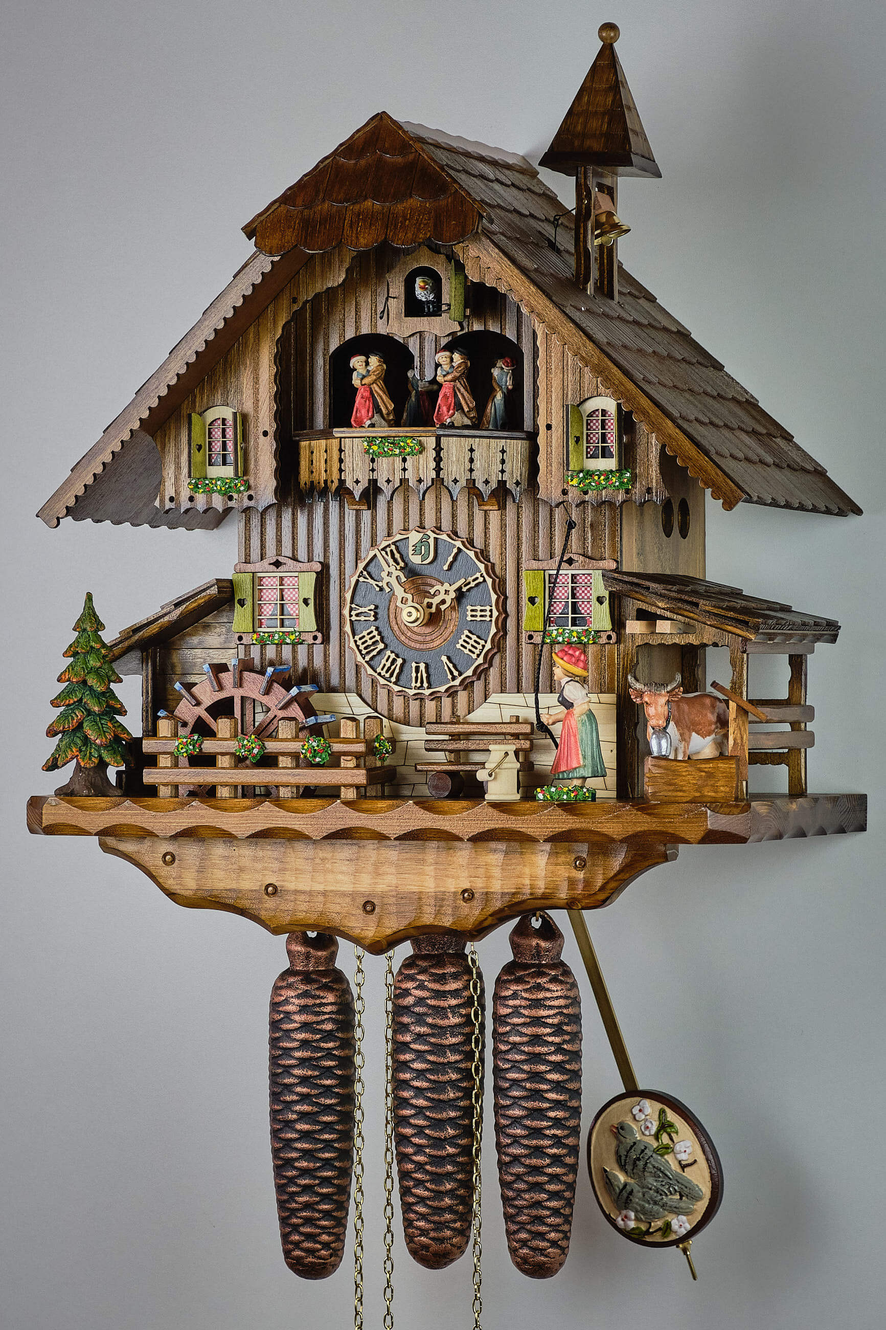 Hönes -Kuckucksuhr 8-Tage Musik Trachtenfrau Kuh Haus 46cm- 86777T