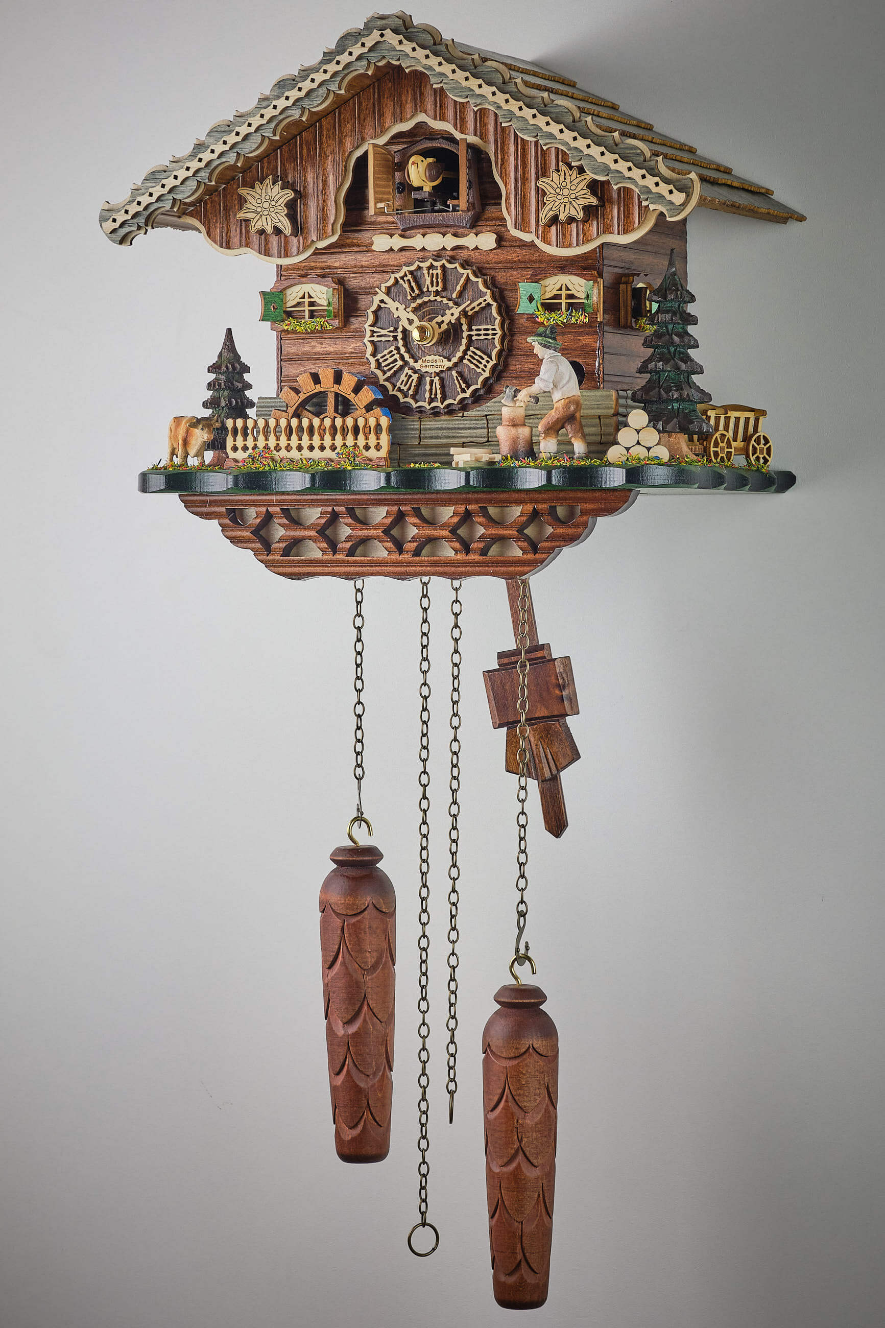 Trenkle -Cuckoo Clock Quartz Movement Black Forest House Wood Chopper with illumination 25cm- 7203 QM HZZG